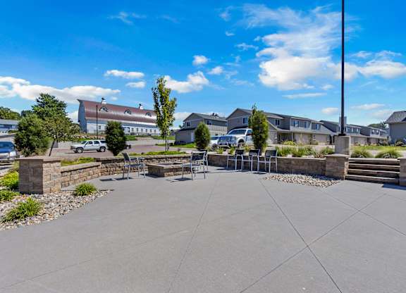 A sunny day at a residential complex with a clear blue sky.