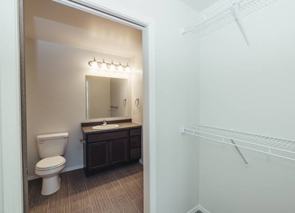 an empty bathroom with a toilet and a sink