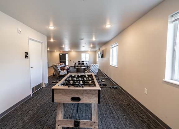 A kitchen with a wooden island in the middle of the room.