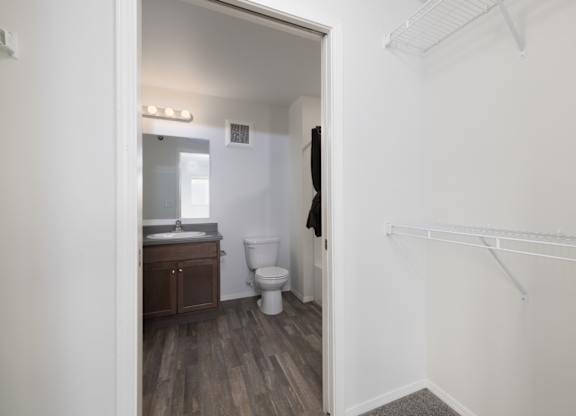 A bathroom with a toilet and sink is shown.