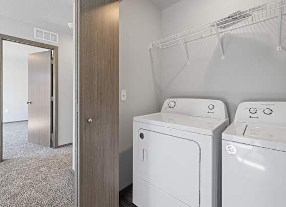 A laundry room with a washer and dryer.