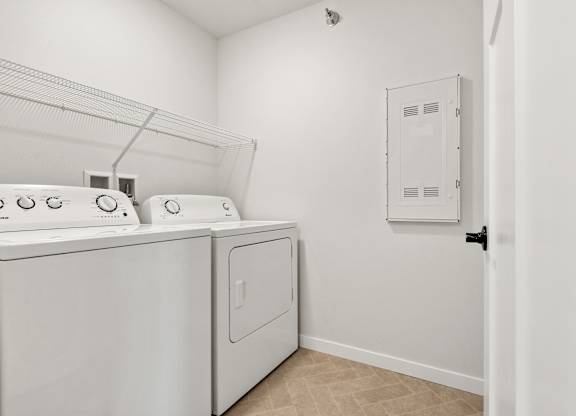 A laundry room with a washer and dryer.