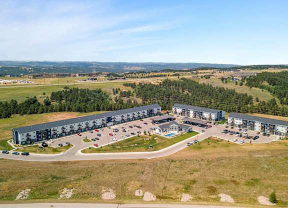 an aerial view of an office building and parking lot
