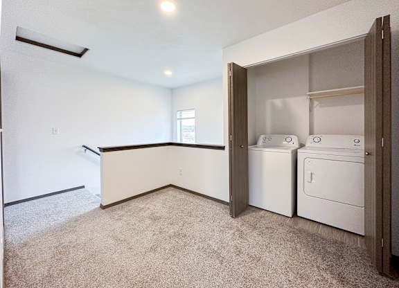 A laundry room with a washer and dryer in it.