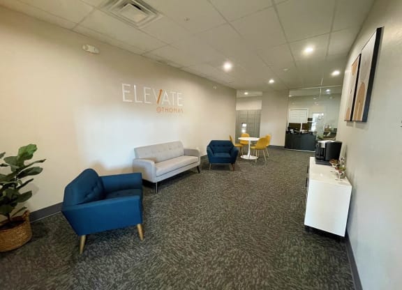 a lounge area with couches and chairs