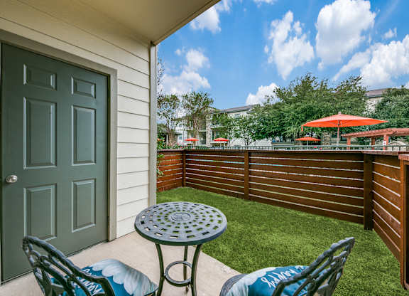 a patio with a table and two chairs  at Sunrise Canyon, Texas, 78148