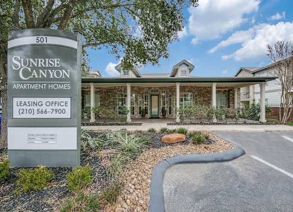 a building with a sign that says sunrise canyon apartments  at Sunrise Canyon, Universal City, TX, 78148