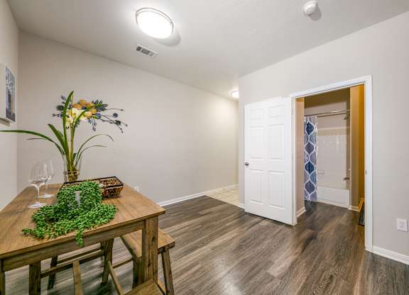 a dining room with a wooden table and chairs at Sunrise Canyon, Universal City, Texas