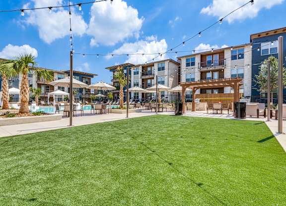 Courtyard Sitting With Umbrella Shades at Park Hill, Texas