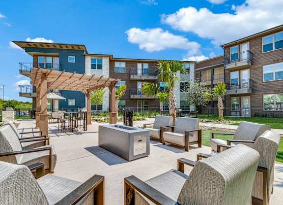 Modern outdoor seating area with a pavilion and chairs at Park Hill, Dallas, TX, 75211
