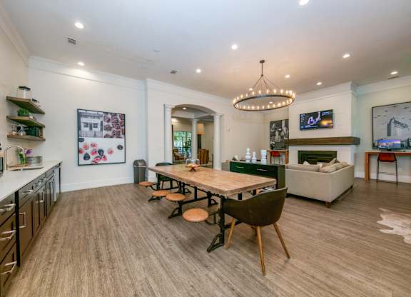 a dining area with a long wooden table and chairs  at Sunrise Canyon, Universal City, Texas