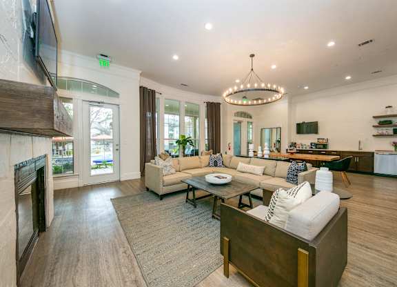 a living room filled with furniture and a large chandelier  at Sunrise Canyon, Texas, 78148