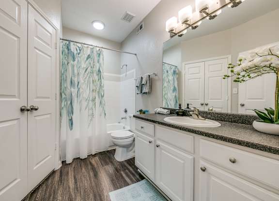 a bathroom with a toilet sink and shower at Sunrise Canyon, Universal City, Texas