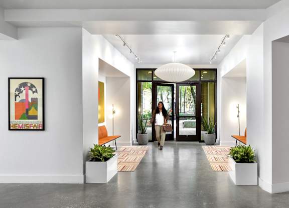 Modern entryway with polished concrete floors at THE'68 Apartments, San Antonio, TX 78205