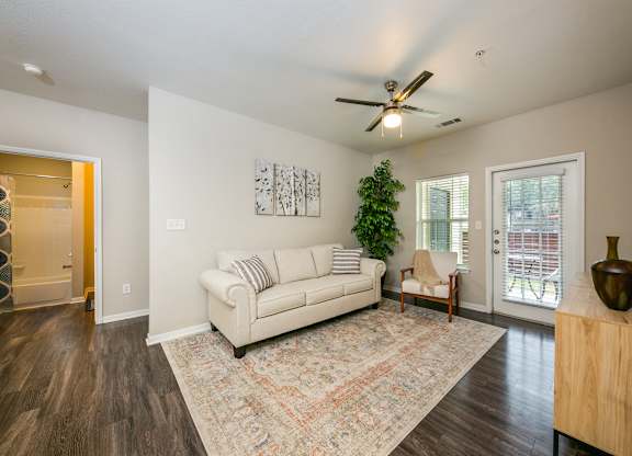 a living room with a couch and two chairs  at Sunrise Canyon, Universal City, Texas
