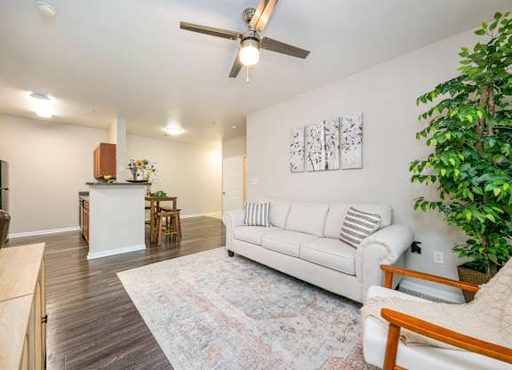 a living room with a white couch and a rug at Sunrise Canyon, Universal City, TX, 78148