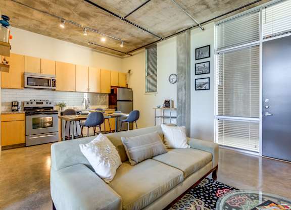 Open concept loft with industrial design features at 1221 Broadway Lofts Apartments, San Antonio, TX 78215