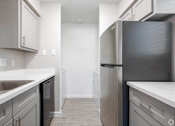 Refrigerator in kitchen at Brook Meadow Village, Austin, 78758