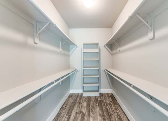 A long white shelf with a blue shelf in the middle at Rosemary Apartments, Texas, 77384