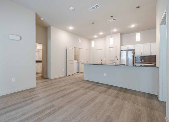 Open concept kitchen and living area at Emilia Apartments, Texas