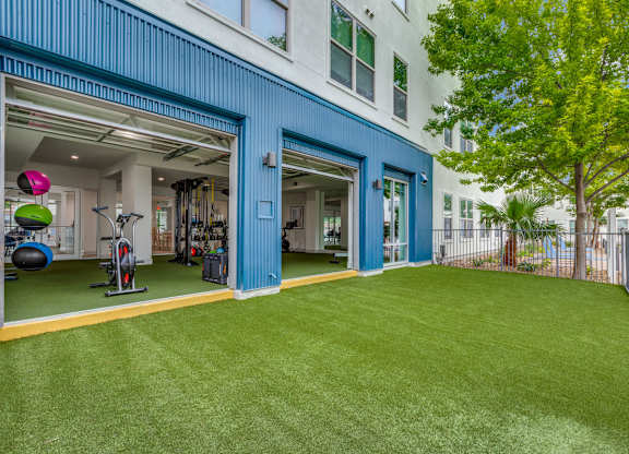 A gym is located in a blue building.
