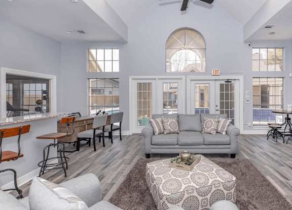 a living room with a couch and a table and a fireplace at Tranquility Grove, Houston, TX