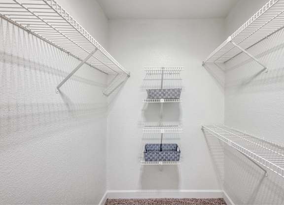 Walk-in closet with wire shelving at Monarch Medical Center Apartments, Houston, Texas