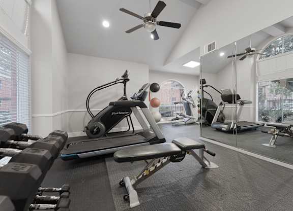 Fitness with cardio and weight equipment at Monarch Medical Center Apartments, Houston