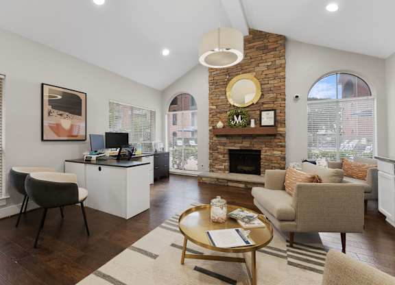 Office area with stone fireplace and lounge seating at Monarch Medical Center Apartments, Texas, 77054
