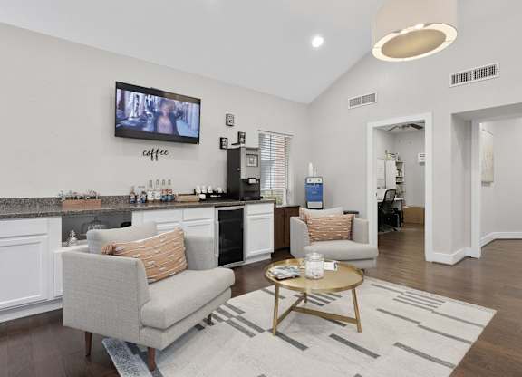 Clubhouse lounge with kitchenette and seating area at Monarch Medical Center Apartments, Houston, TX 77054