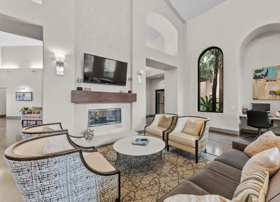 Spacious living room with fireplace and high ceilings at Melia Medical Center Apartments, Houston