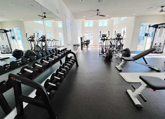 a fitness room filled with weights and cardio equipment at The Fitzroy San Marcos, San Marcos