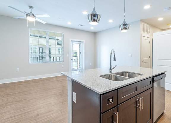 a kitchen with a sink and a counter top at The Fitzroy San Marcos, Texas