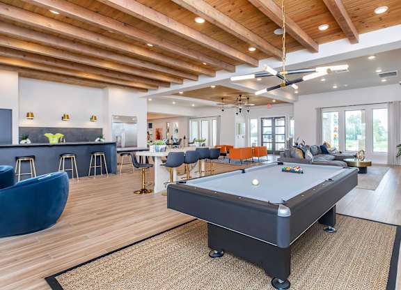 Clubhouse lounge with pool table and seating at Sienna at Westover Hills Apartments, San Antonio, 78253