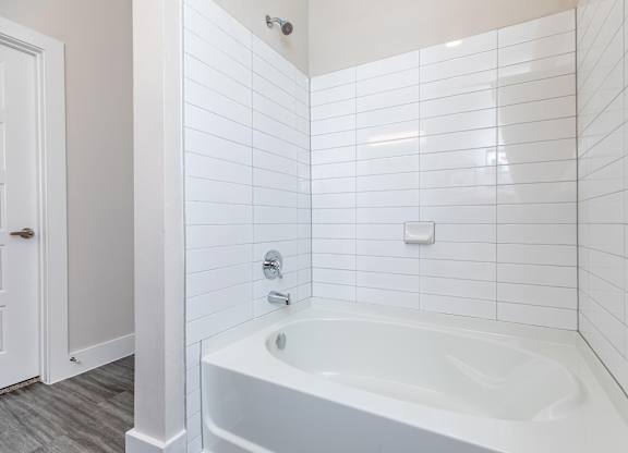 White subway tile bathtub with chrome fixtures at Sienna at Westover Hills Apartments, San Antonio, 78253