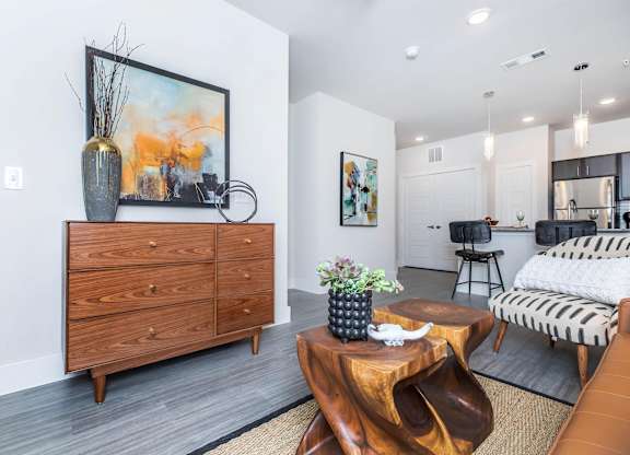 Open concept living area with wooden coffee table at Sienna at Westover Hills Apartments, San Antonio, 78253