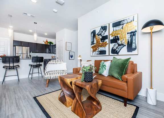 Open concept living and dining area with modern furnishings at Sienna at Westover Hills Apartments, San Antonio, Texas