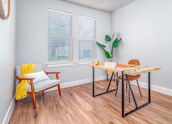 Room with wooden table at The Landings at Brooks City-Base, San Antonio, 78235