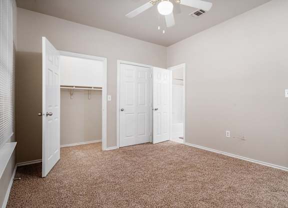 Spacious bedroom with walk-in closet at Houston Street Townhomes Apartments, Texas, 78220