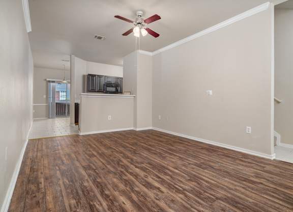 Open living and dining area with wood flooring at Houston Street Townhomes Apartments, Texas, 78220