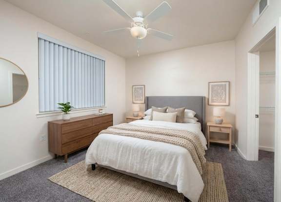 Bedroom with nightstand at Terracina at Lancaster | Affordable Apartments, Lancaster, California