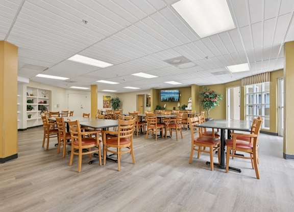 A large room with tables and chairs.