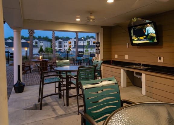 Picnic Grilling Area with TV at Abberly Crossing Apartment Homes by HHHunt, Ladson, 29456