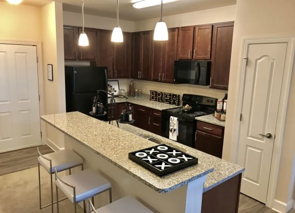 Mocha Wood Cabinets at Abberly at Southpoint Apartment Homes, Fredericksburg, VA, 22407