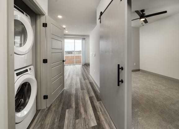 an open laundry room with a washer and dryerat Abberly Foundry Apartment Homes, Nashville, TN, 37206