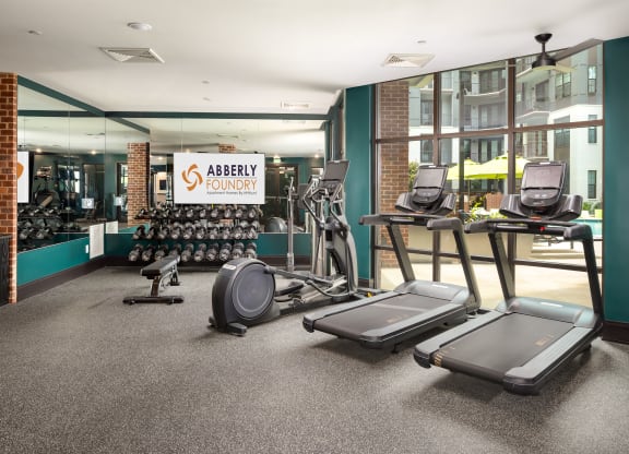 a gym with treadmills and other exercise equipment at Abberly Foundry Apartment Homes, Nashville