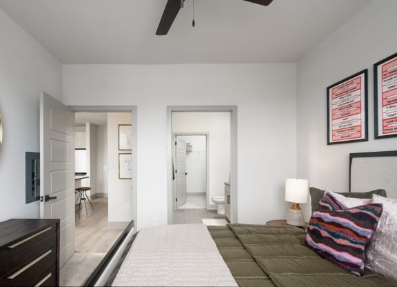 a bedroom with a large bed and a ceiling fan at Abberly Foundry Apartment Homes, Nashville, TN