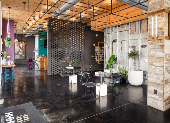a room with black flooring and wood ceilings  at Abberly Noda Vista Apartment Homes, Charlotte, North Carolina