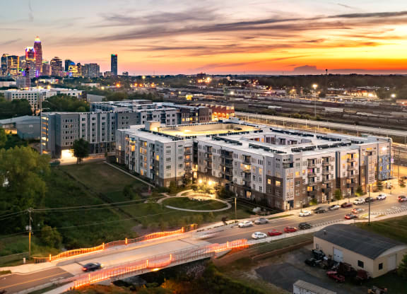 an aerial view of an apartment complex with the minneapolis skyline in the background  at Abberly Noda Vista Apartment Homes, Charlotte, NC