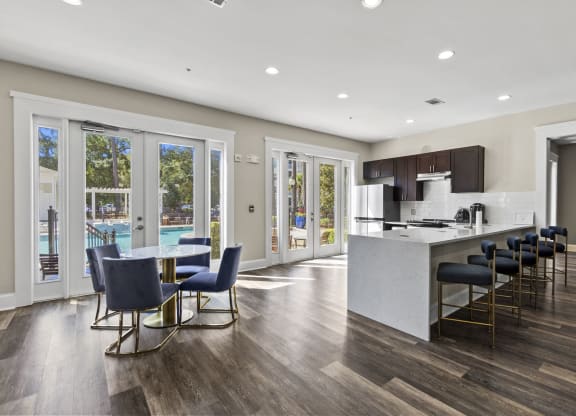 Clubhouse kitchen with bar and eating area at West Ashley Apartment Homes, South Carolina,  29414
